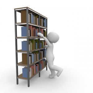 Clip art of person looking for books on library shelves